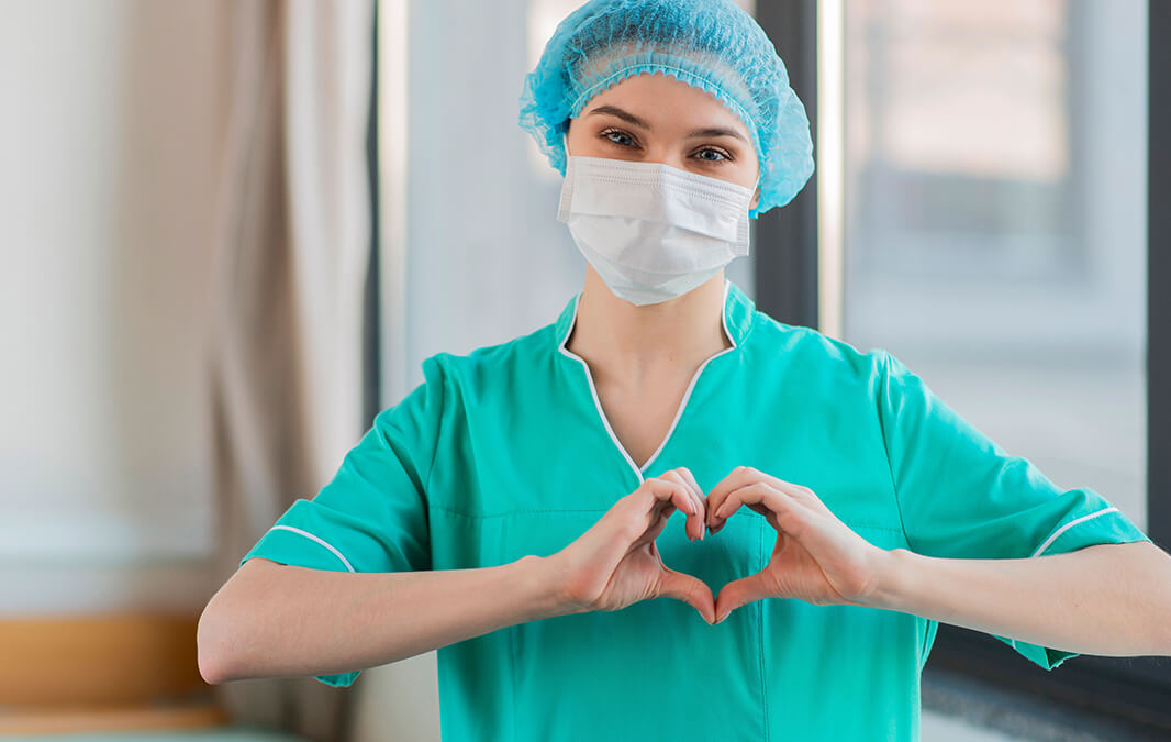 Nurse Making Heart Shape with Hand